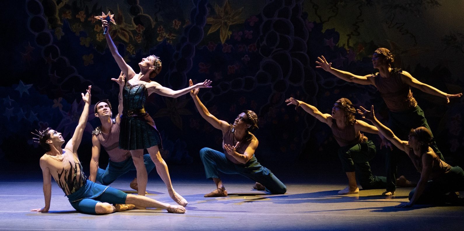 Ballet dancers performing a dramatic stage routine